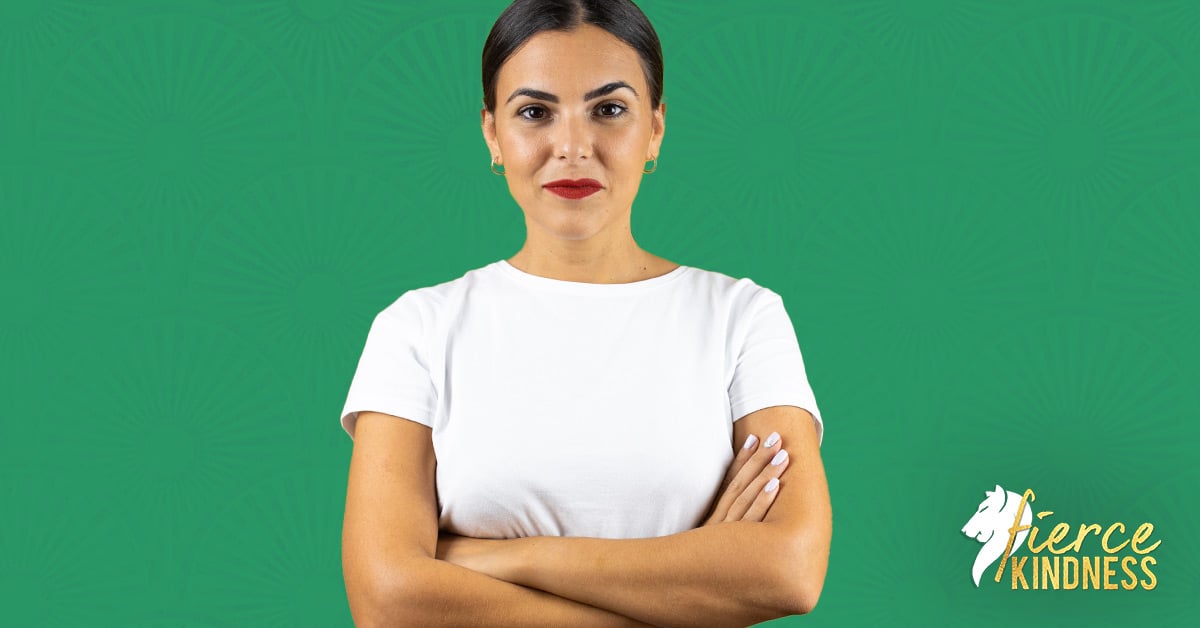 Smiling confident resilient woman against a green background