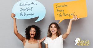 2 women holding signs with labels on there like Office Mom and Chatterbox