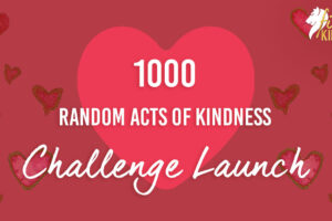 1000 RAKs Challenge Launch text over large heart with read background and hearts