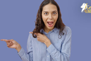 Young woman with comedic expression pointing at something