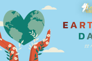 Green Heart Shaped Earth held in Hands with flowers saying Earth Day