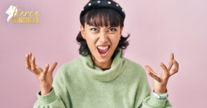 Frustrated slightly comical woman throwing hands in air