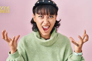 Frustrated slightly comical woman throwing hands in air