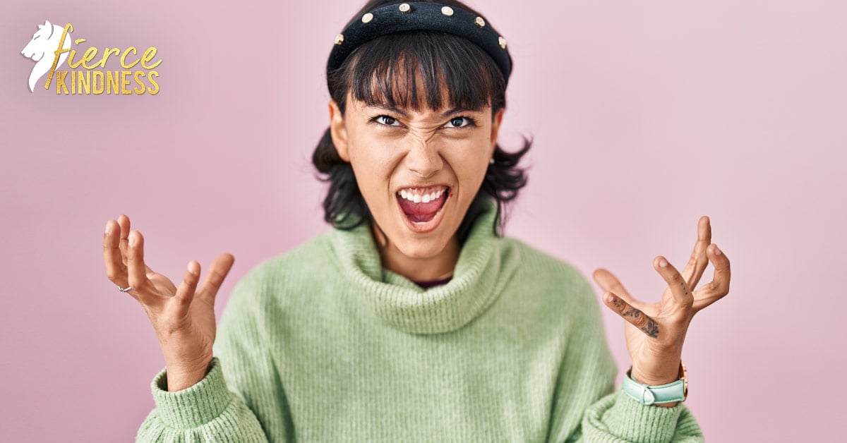 Frustrated slightly comical woman throwing hands in air